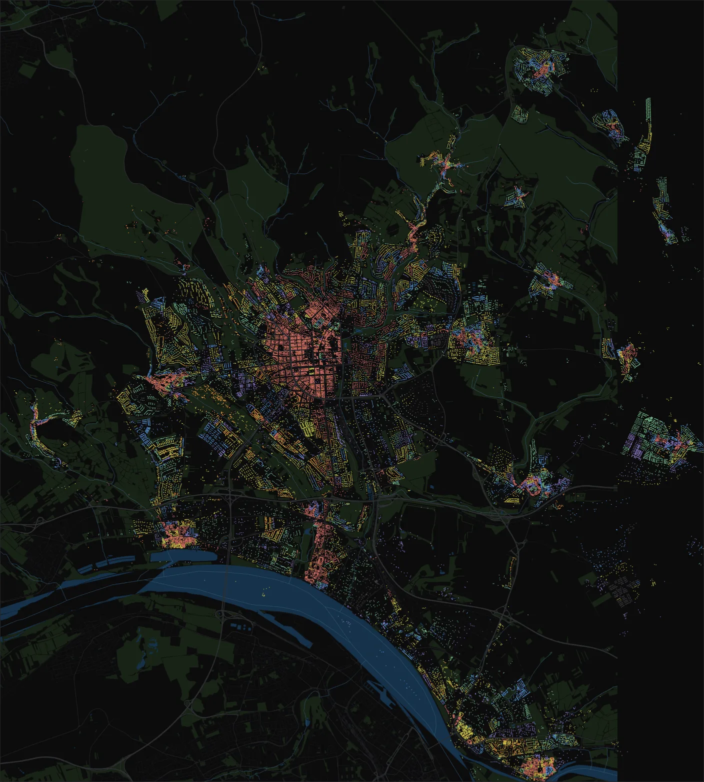 Map of Wiesbaden with every building coloured by its construction era, a coral historic core surrounded by later yellow, green and blue districts
