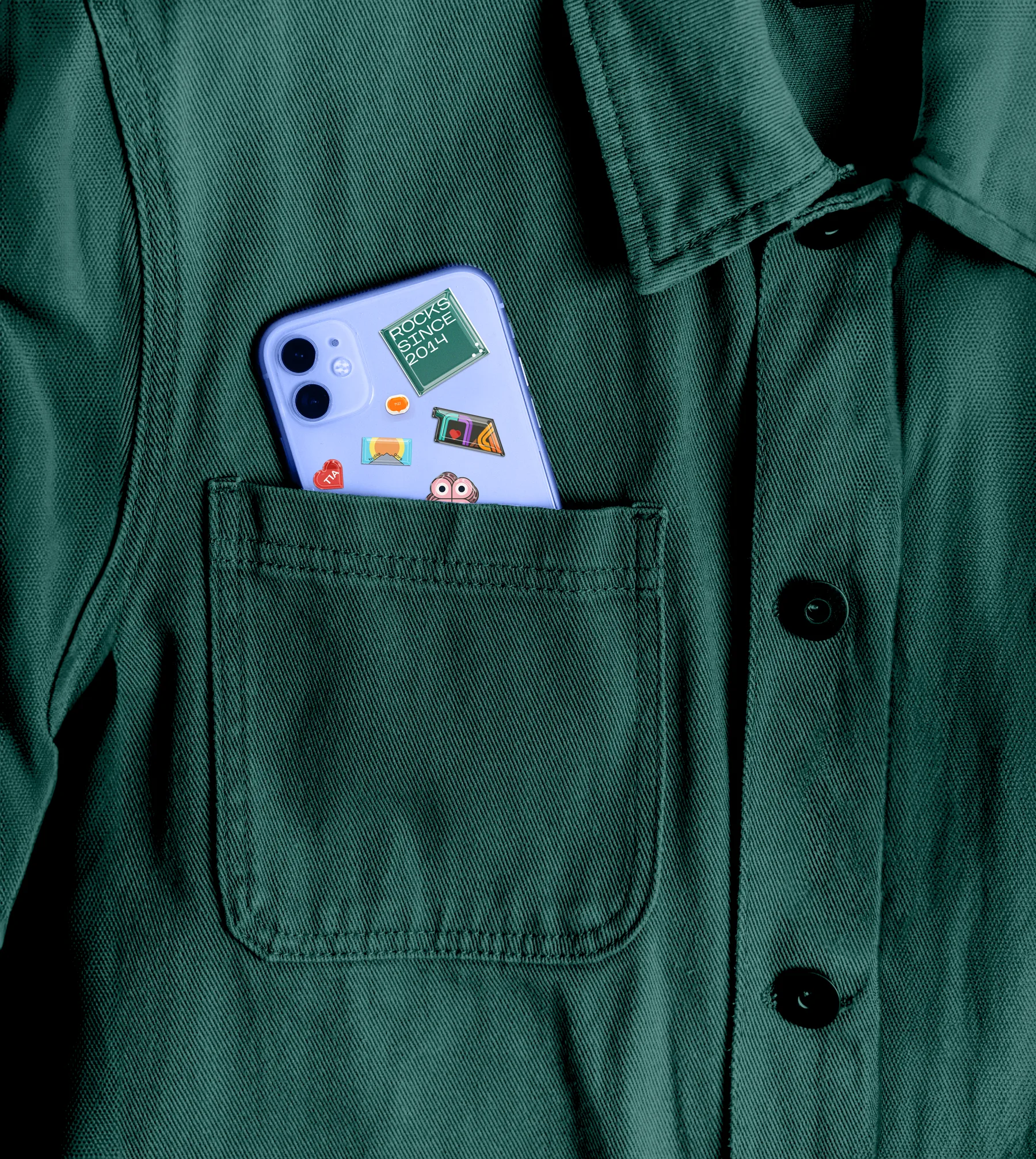 Phone with T1A stickers in a shirt pocket
